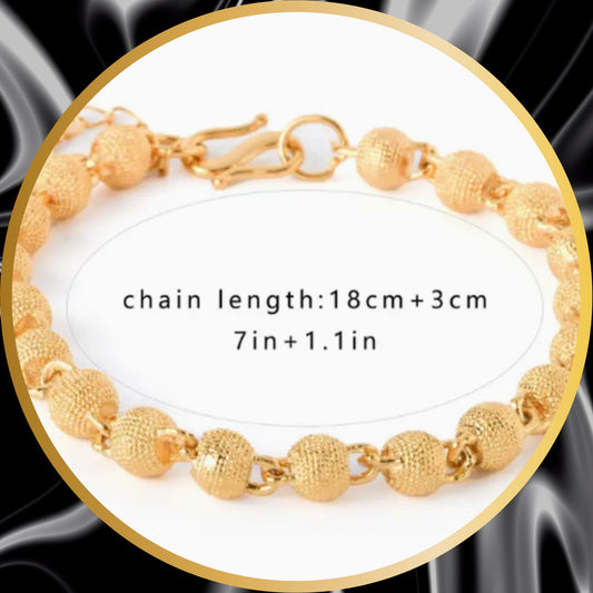 A gold plated stainless steel bracelet  formed by little ornaments.