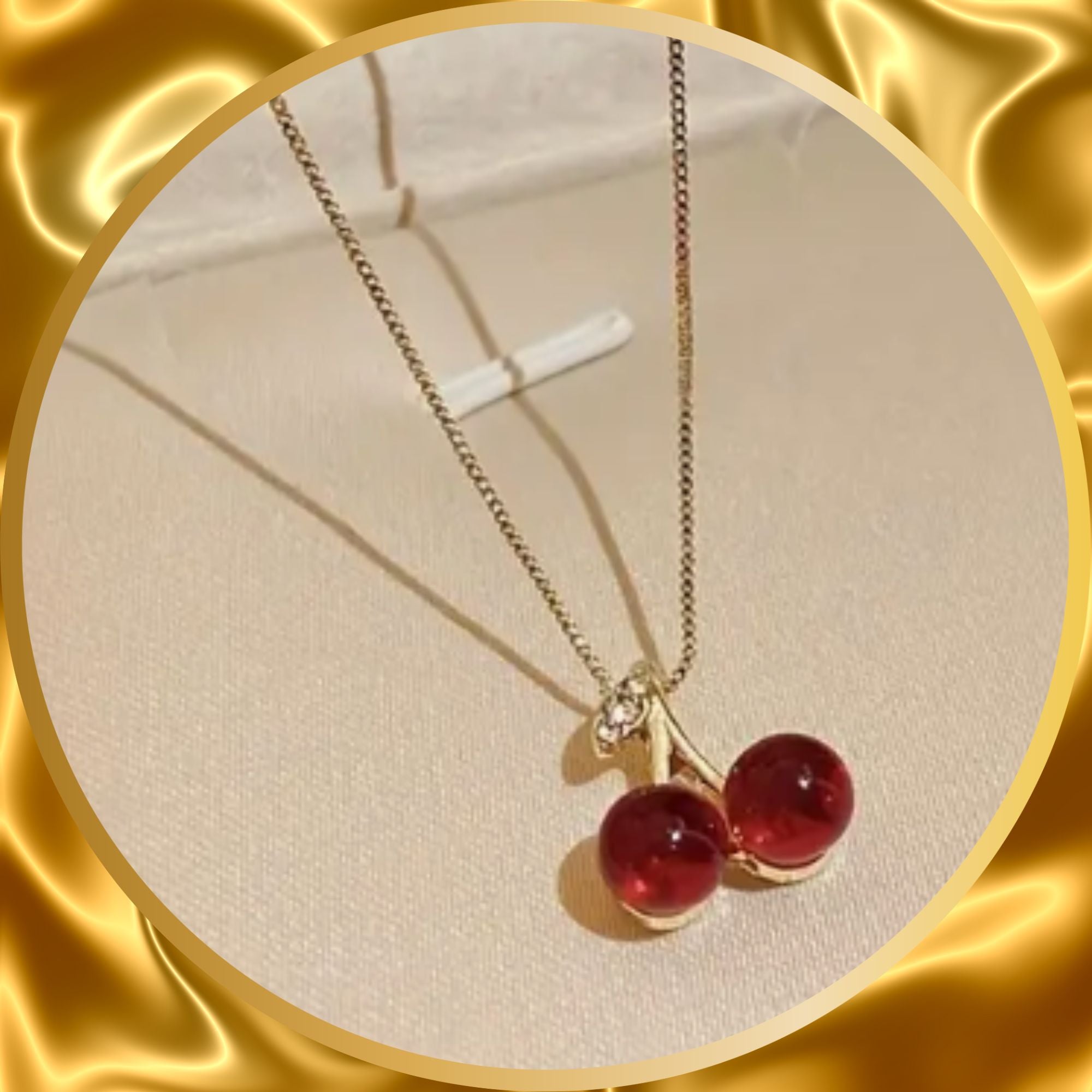 a small pair of red cherry pendent stainless steel necklace.