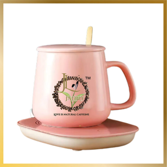 Beautiful luxury set of pink ceramic coffee mug with heating pad and golden spoon